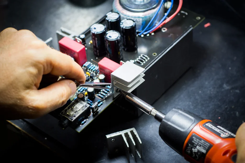 Technician working on electronic hardware